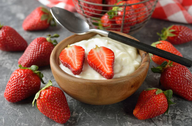 istock Natural white yogurt with strawberries 665740936