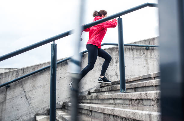 istock Woman Running Up The Stairs 665743378