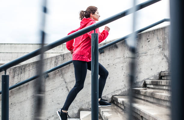 istock Woman Running Up The Stairs 665743386