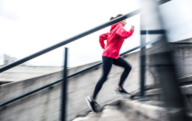 istock Young Female Athlete Running up The Staircase 665743394