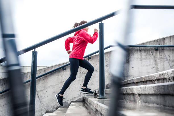 istock Woman Running Up The Stairs 665743404