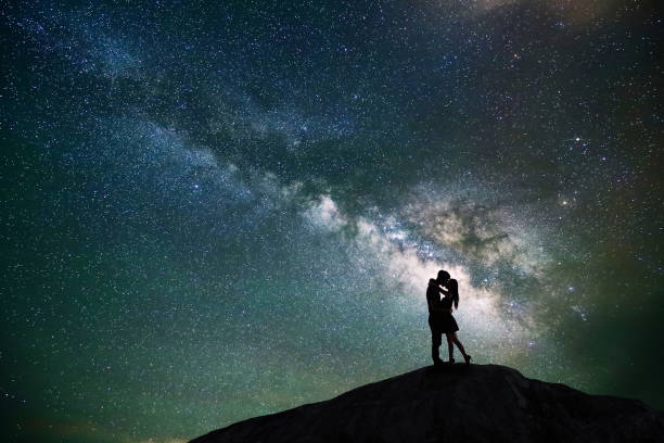 istock couple with night scene 665743454