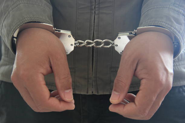 istock Male hands in handcuffs 665743502
