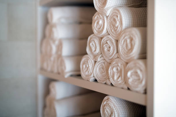 istock White clean towels in spa massage room as background 665750446