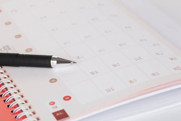 istock Black pen on an empty traditional Chinese calendar 665754704