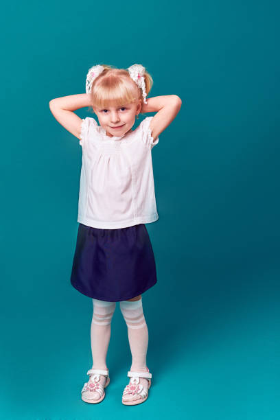 istock School girl with backpack smiling 665754798
