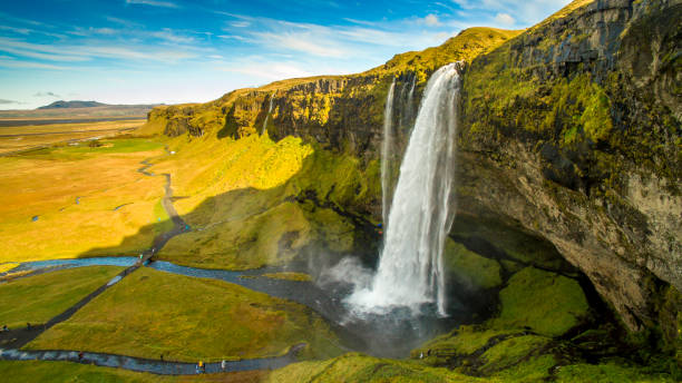 istock Scenic view of Seljalandsfoss and mountains 665757328