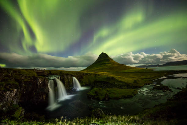istock Aurora over Kirkjufell and waterfall at night 665757628
