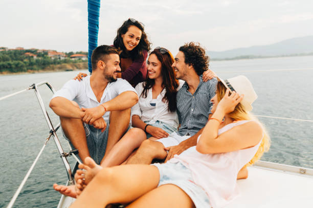 istock Happy friends on a yacht 665757782