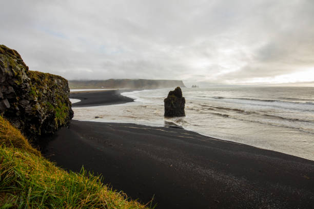 istock Scenic view of basalt sea strack in Vik 665757806