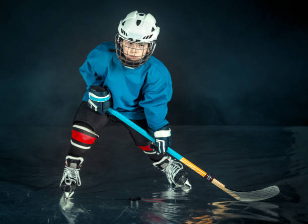 istock Aimed To Win. Little Hockey Player 665757966
