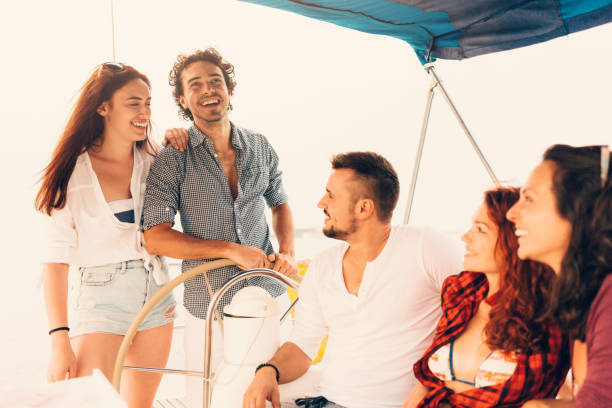 istock Happy friends on a yacht 665758124