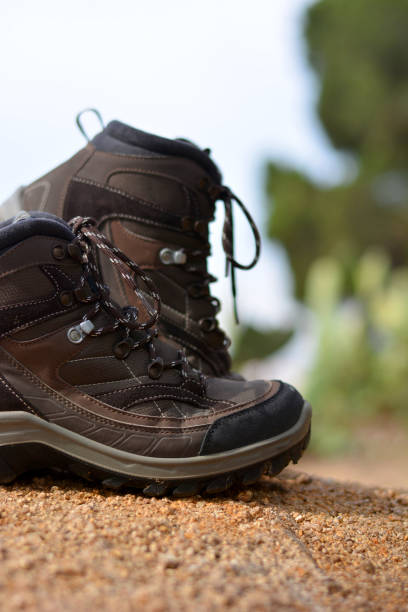 istock Brown hiking boots in a forest 665758140