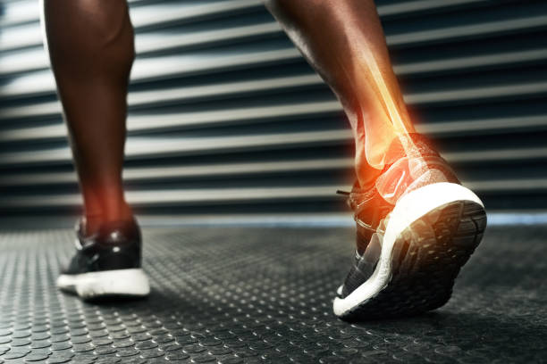 Rehabilitating his ankle after injury Rearview shot of an unrecognizable man's ankle during a workout joint body part photos stock pictures, royalty-free photos & images