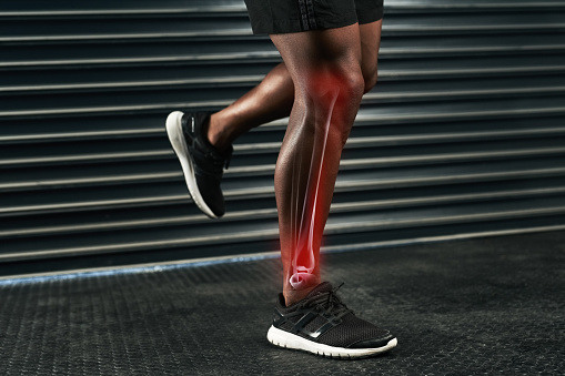 Rearview shot of an unrecognizable man's legs during a workout