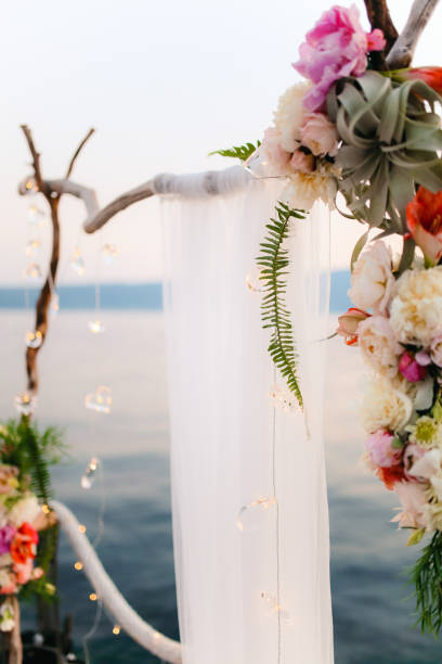 istock Wooden arch for the wedding ceremony at sunset 665768128