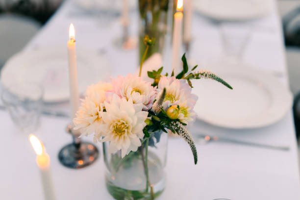 istock White asters on the table in the restaurant. Wedding decorations 665770654