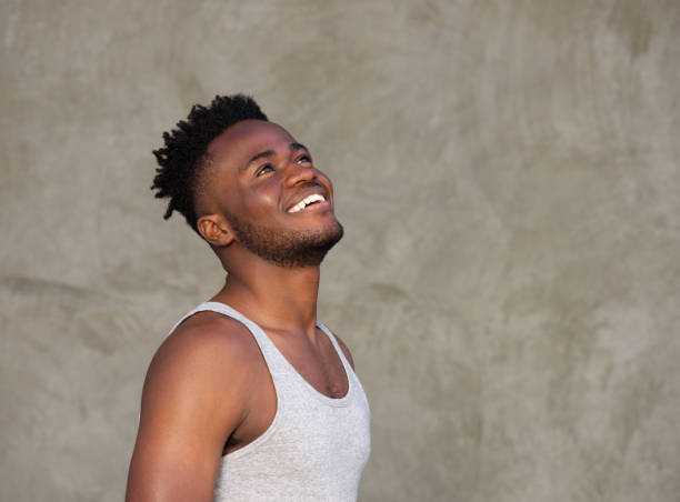 istock sporty muscular african man laughing 665771600