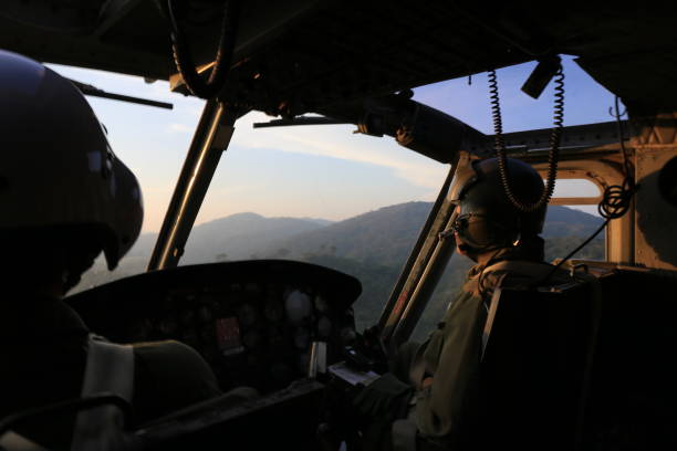 istock cockpit view helicopter pilot patrol flight near Thailand-Myanmar border 665776510