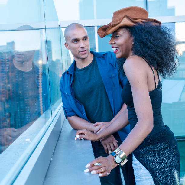 istock Young Latino couple have dinner and dating on rooftop 665779352