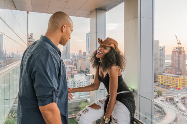 istock Young Latino couple have dinner and dating on rooftop 665779372