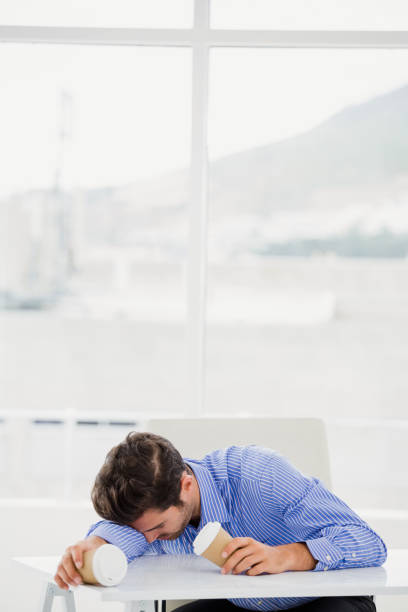 istock Businessman relaxing on desk 665779536