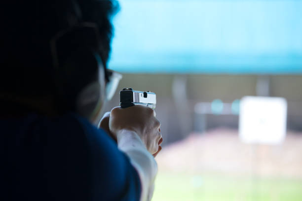 istock law enforcement aim pistol by two hand in academy shooting range 665779842