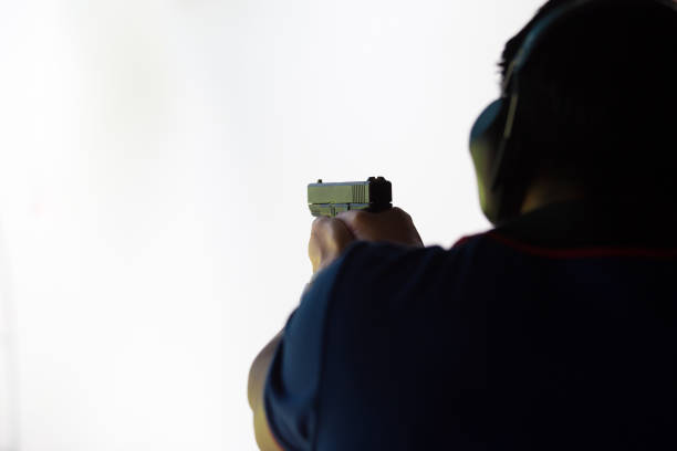 istock law enforcement aim pistol by two hand in academy shooting range 665779892