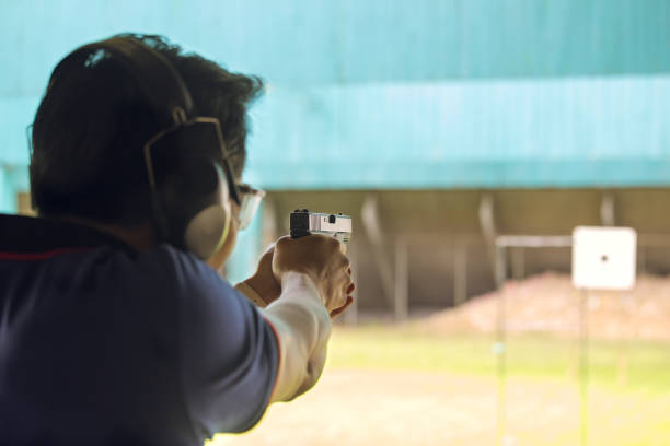istock law enforcement aim pistol by two hand in academy shooting range 665779984
