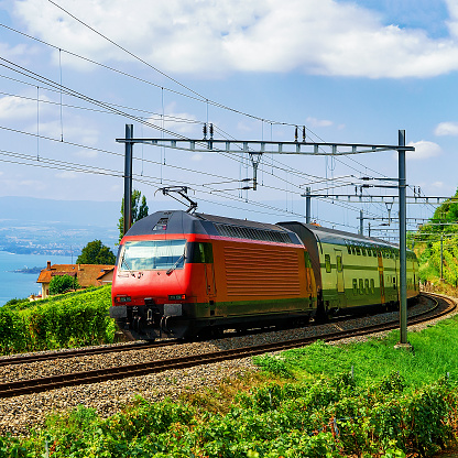 Train and railroad near Lavaux Vineyard Terraces Lake Geneva Alps