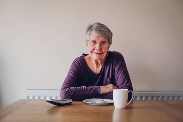 Senior Woman Enjoying Tea & Bisciut