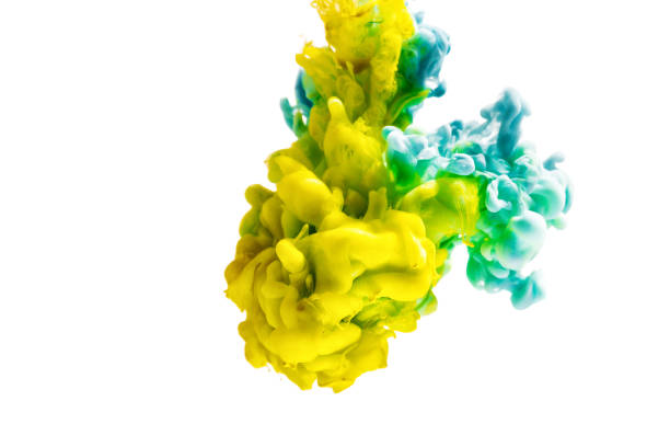 istock colorful ink isolated on white background. yellow blue drop swirling under water. Cloud of ink in water. 665794338