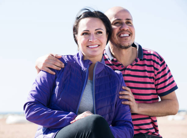 istock couple holding each other on the beach 665801784