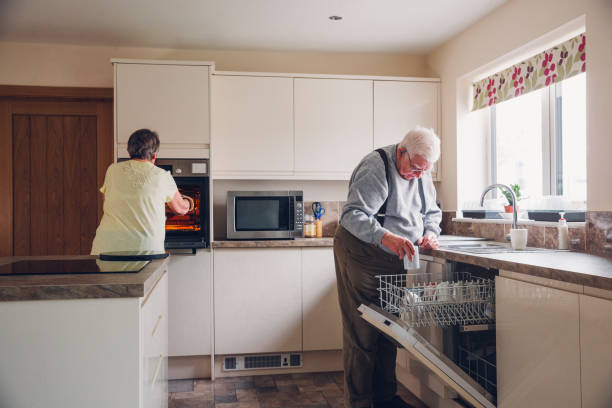 Elderly Couple working in the Kitchen