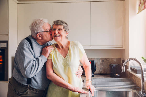 never too old for a cheeky kiss! - senior women cheerful overweight smiling imagens e fotografias de stock