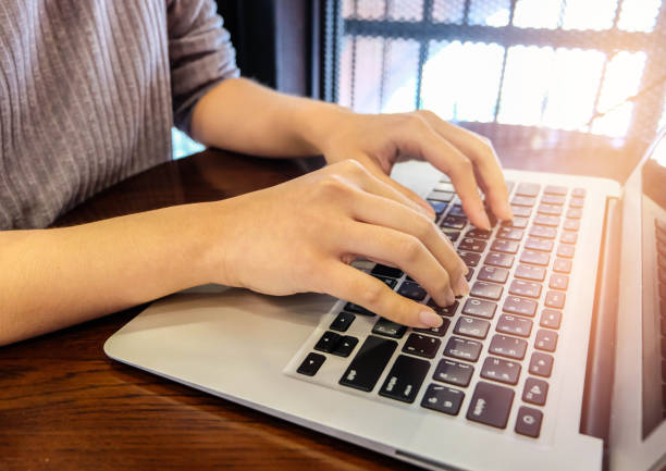 istock Woman office worker is typing keyboard 665805950