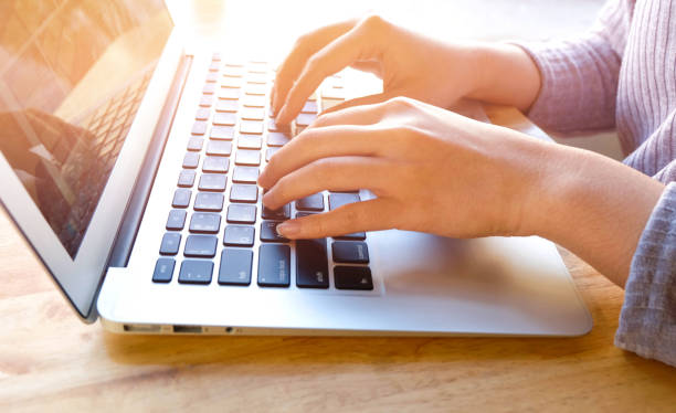 istock Woman office worker is typing keyboard 665807438