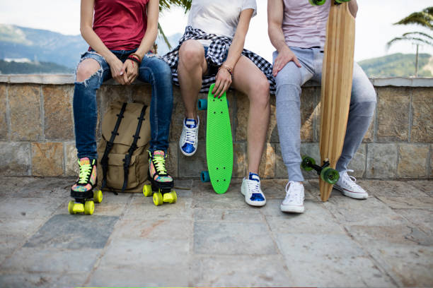 Adventuring on wheels, close up of roller skates, penny board, longboard