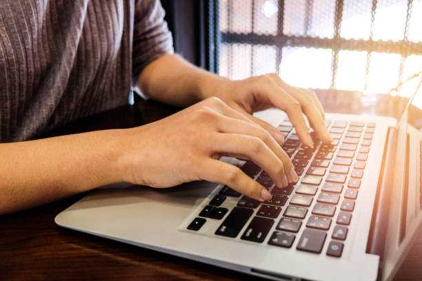 istock Woman office worker is typing keyboard 665812956