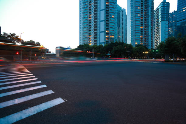 istock Empty road surface with city landmark buildings of night 665813100