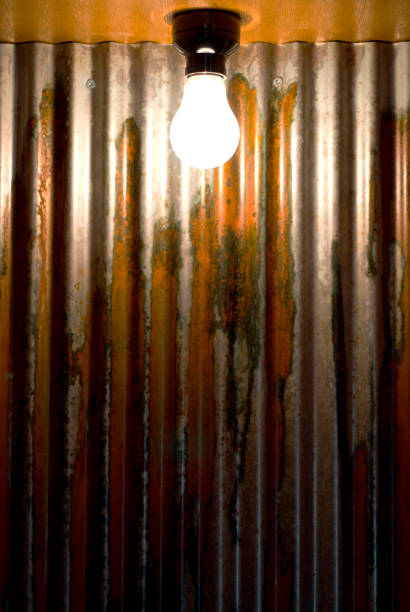 istock Corrugated iron walls and bare light bulbs 665816728
