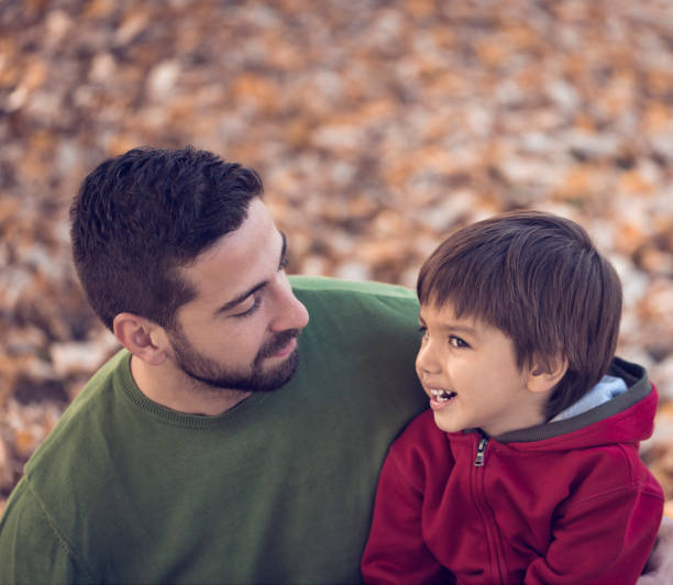 istock Father and son enjoying in beautiful day in park 665823406