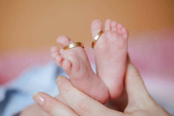 istock adorable newborn baby feet 665823526