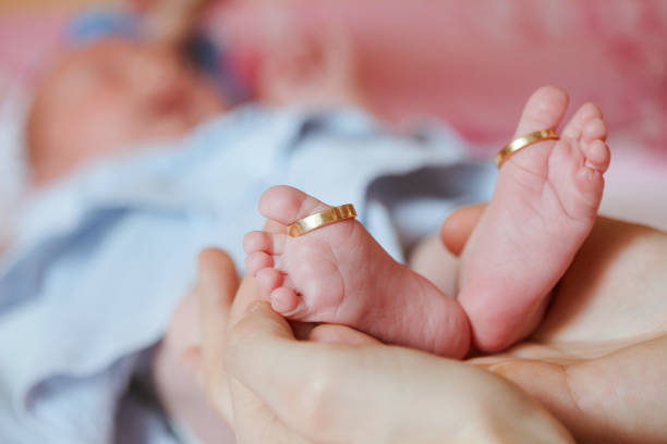 istock adorable newborn baby feet 665823604