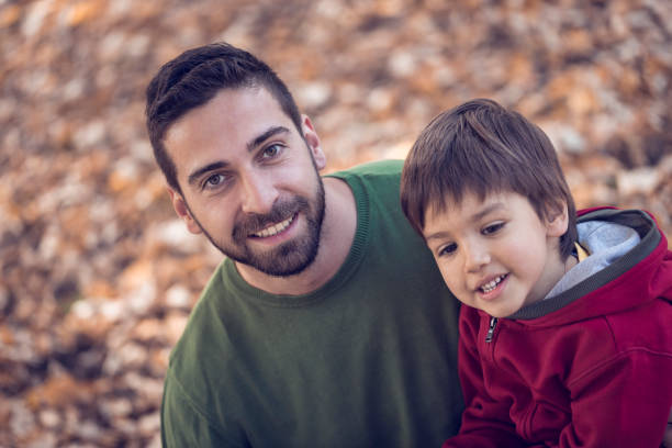 istock Father and son enjoying in beautiful day in park 665824306