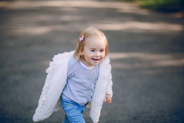 istock young family walking in the park 665824578