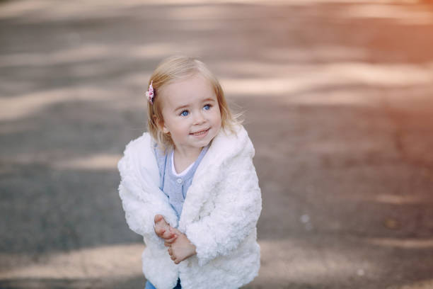 istock young family walking in the park 665836852