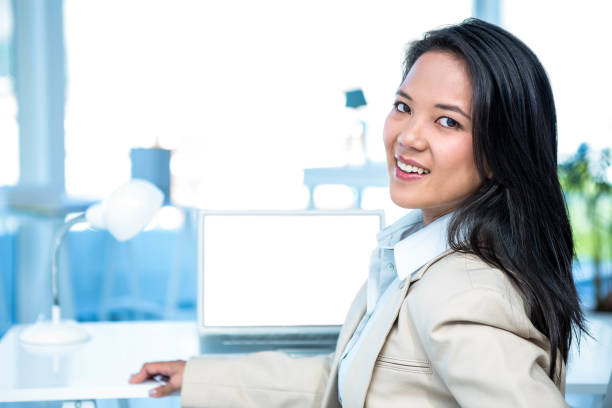 istock Smiling businesswoman looking at camera 665837188