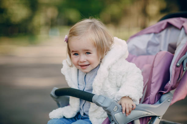 istock young family walking in the park 665837752