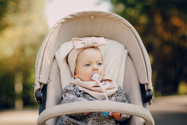 istock young family walking in the park 665838144